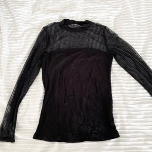 Top with sheer striped neck and sleeve detail.